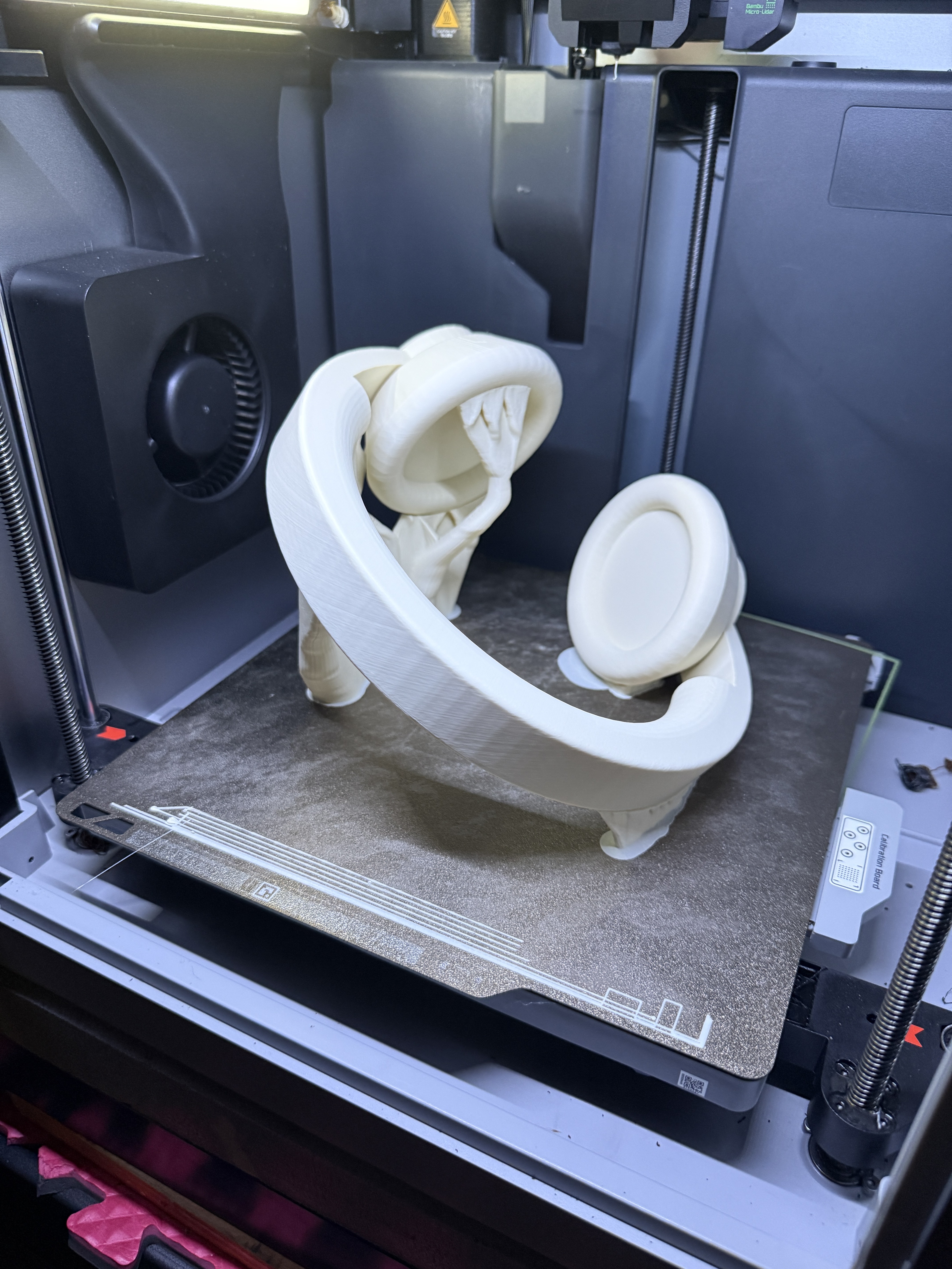 3D-printed part on the build plate of a 3D printer