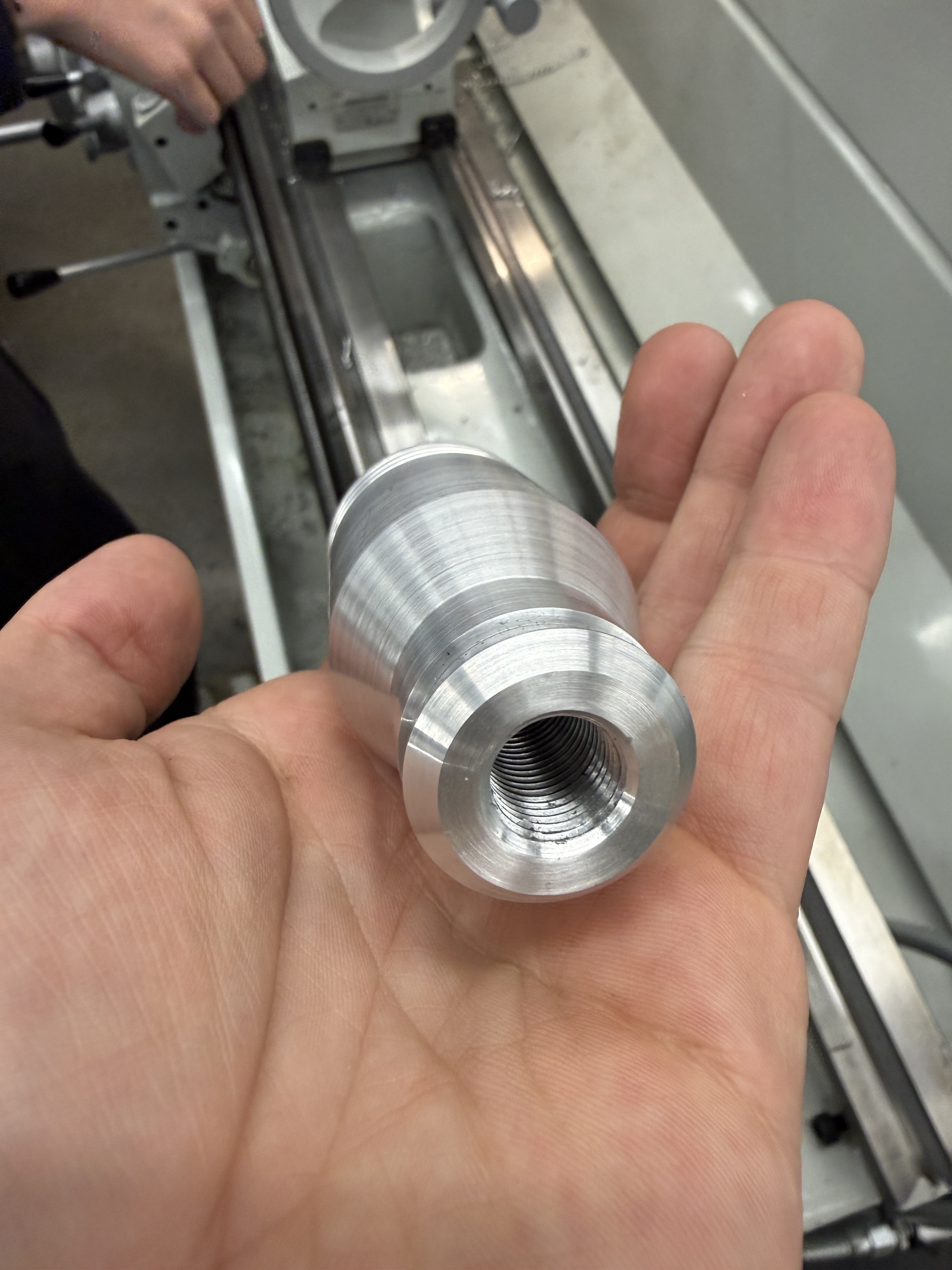 Machined aluminum shaft with threaded bore