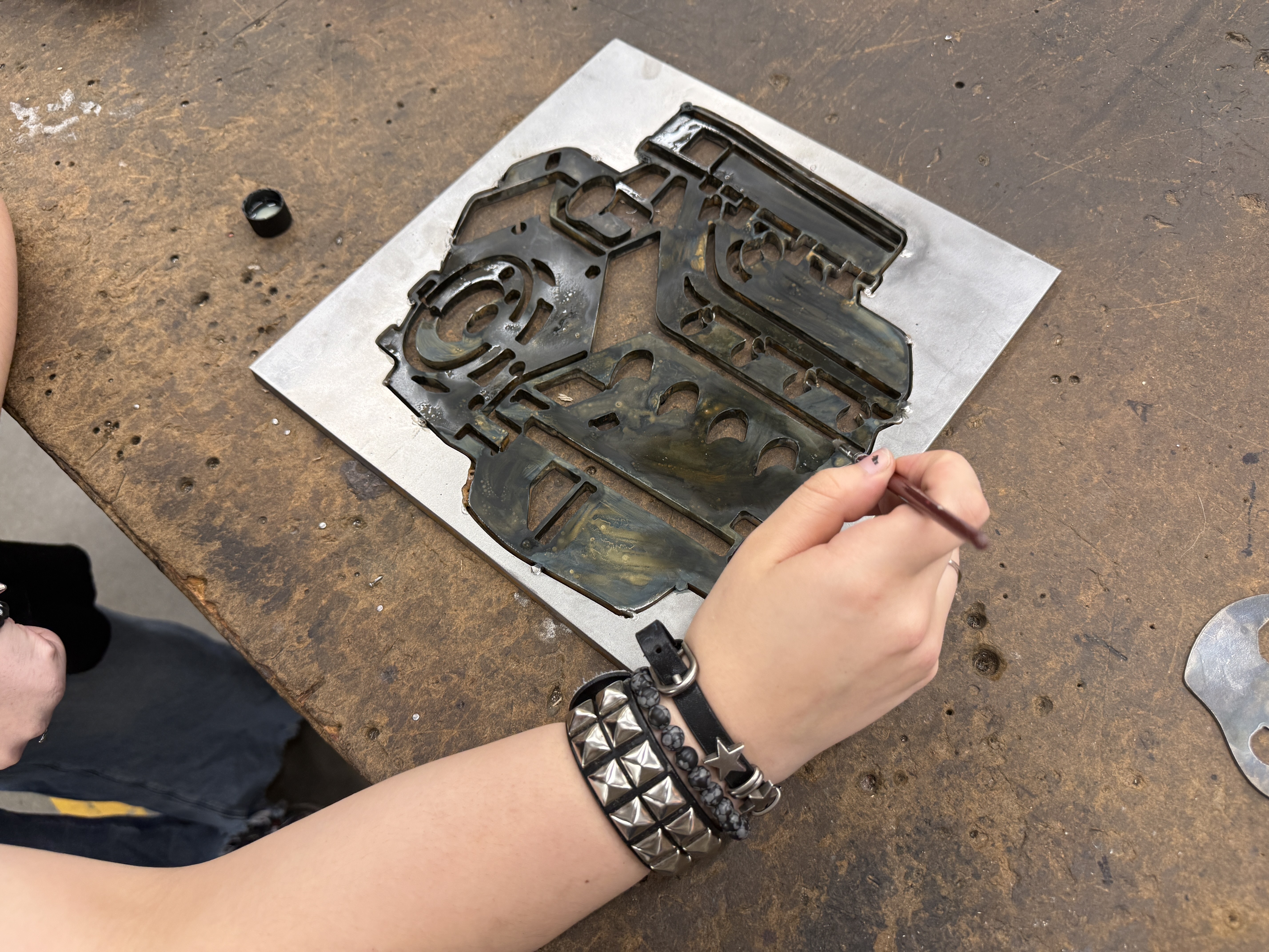 Applying finish to a plasma-cut engine silhouette