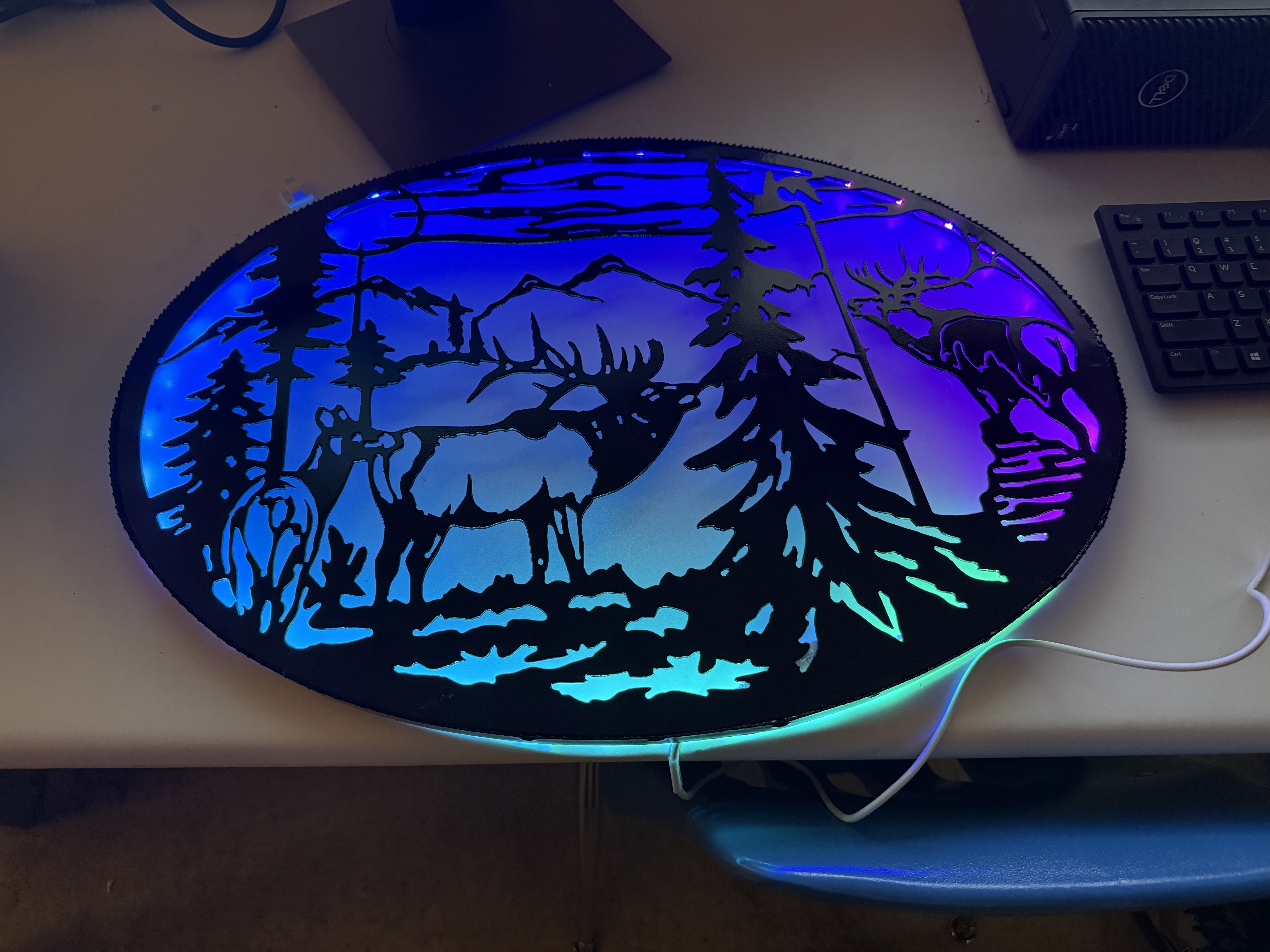 Plasma-cut wildlife panel with blue LED backlighting