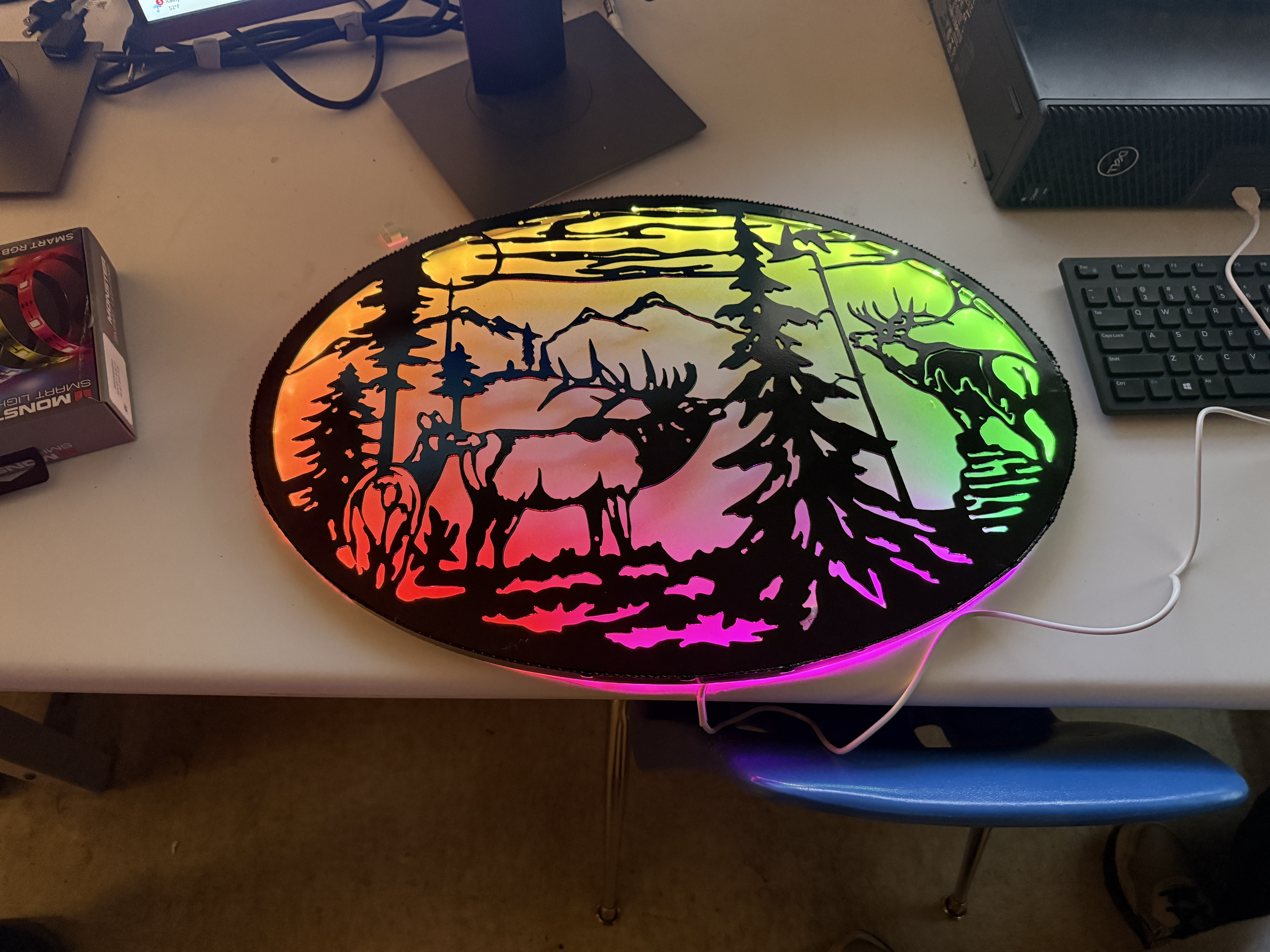 Plasma-cut wildlife panel with warm LED backlighting