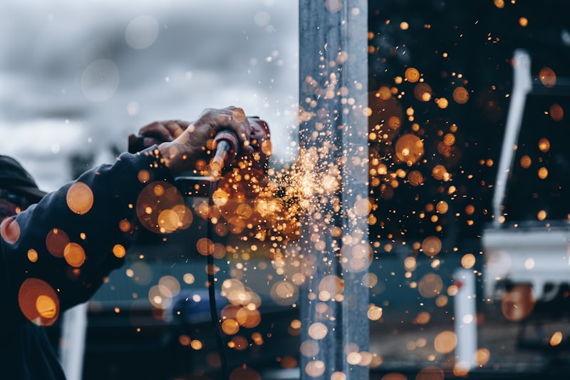Metal sparks flying during plasma cutting fabrication work